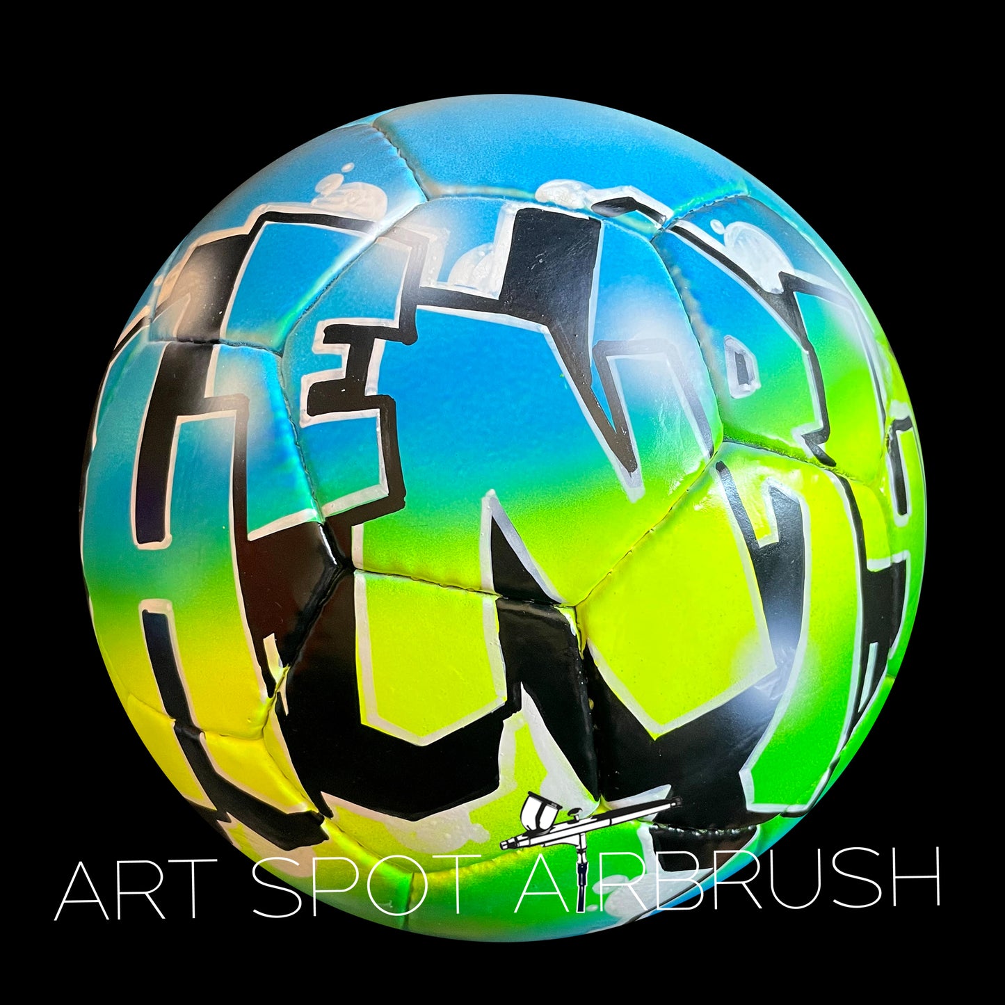 A colorful soccer ball with graffiti-style lettering on it.