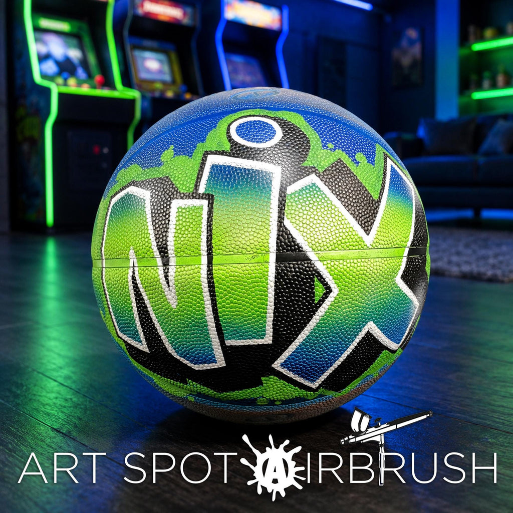 A colorful basketball with the word "NIX" painted on it, sitting on a wooden floor in a room with arcade cabinets in the background.