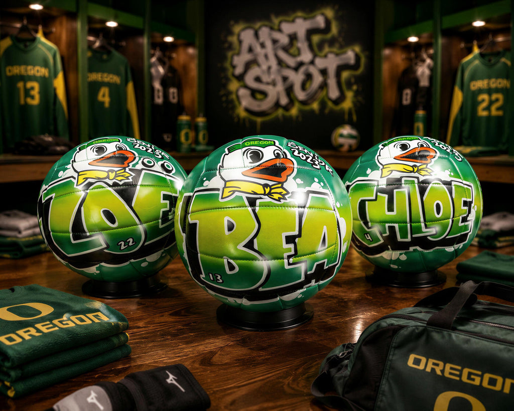 three green soccer balls with the word "BEA" written on them, placed on a wooden surface. In the background, there are several green jerseys and a sign that says "ART SHOT".