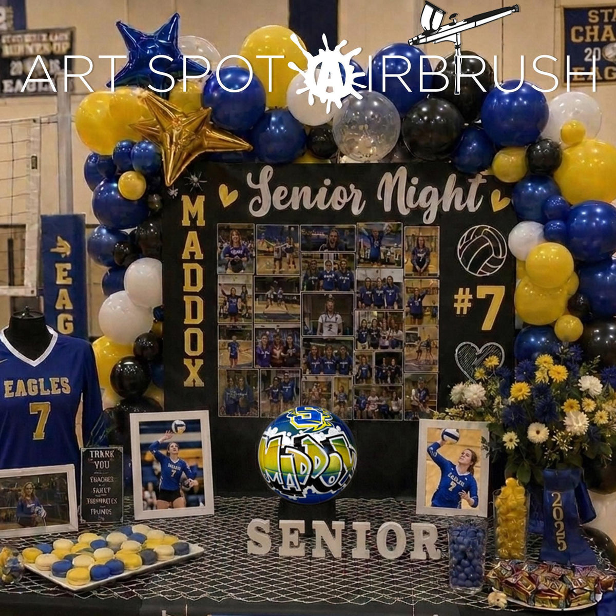 The image is a display for a senior night event, featuring a collage of photos, balloons, and a sign that reads "SENIOR NIGHT", and a custom volleyball from Art Spot Airbrush
