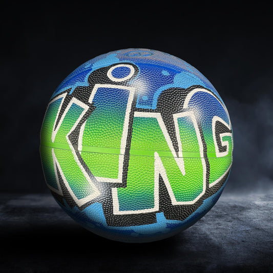 A colorful basketball with the word "KING" painted on it, set against a dark background.