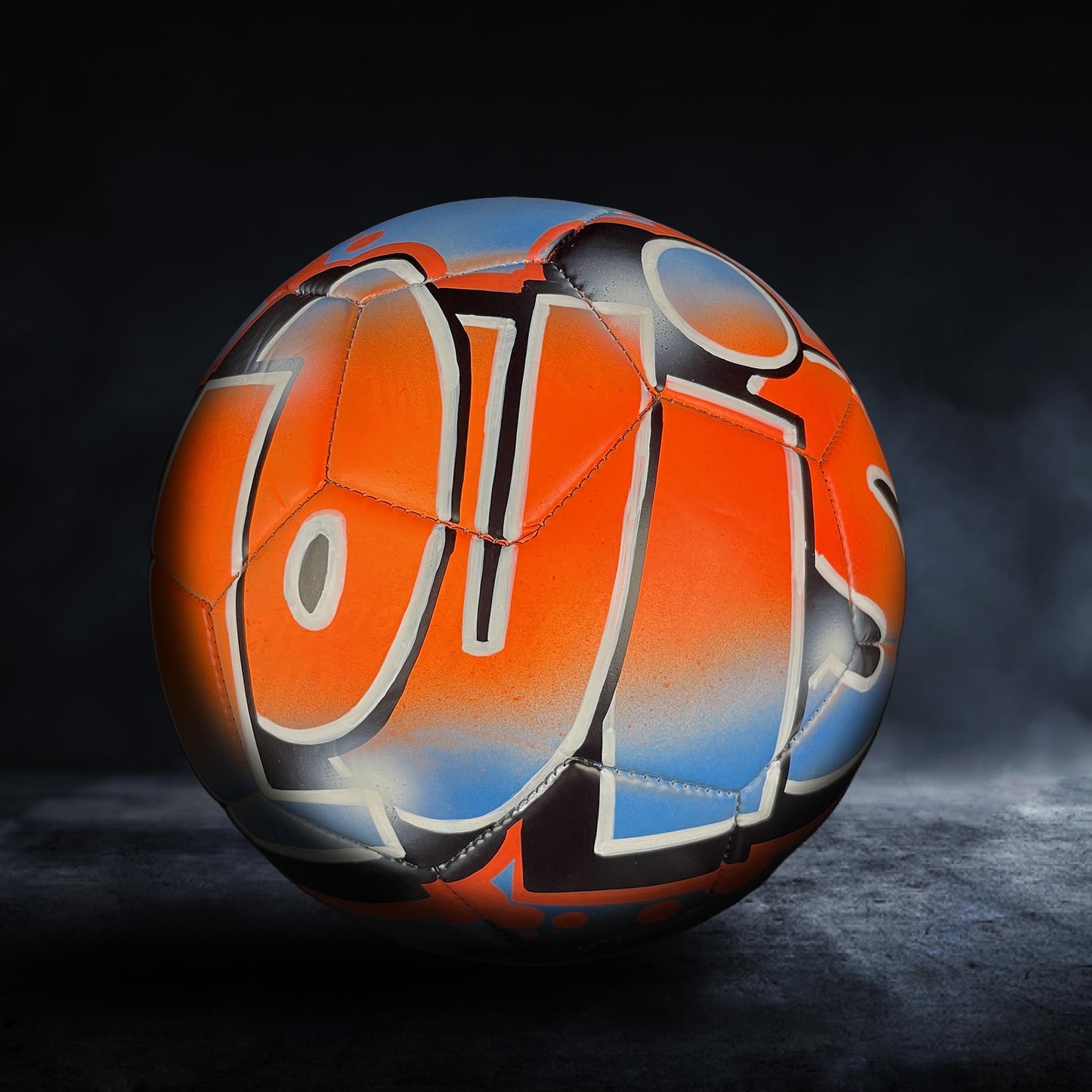 a soccer ball with a colorful, graffiti-style design on it.