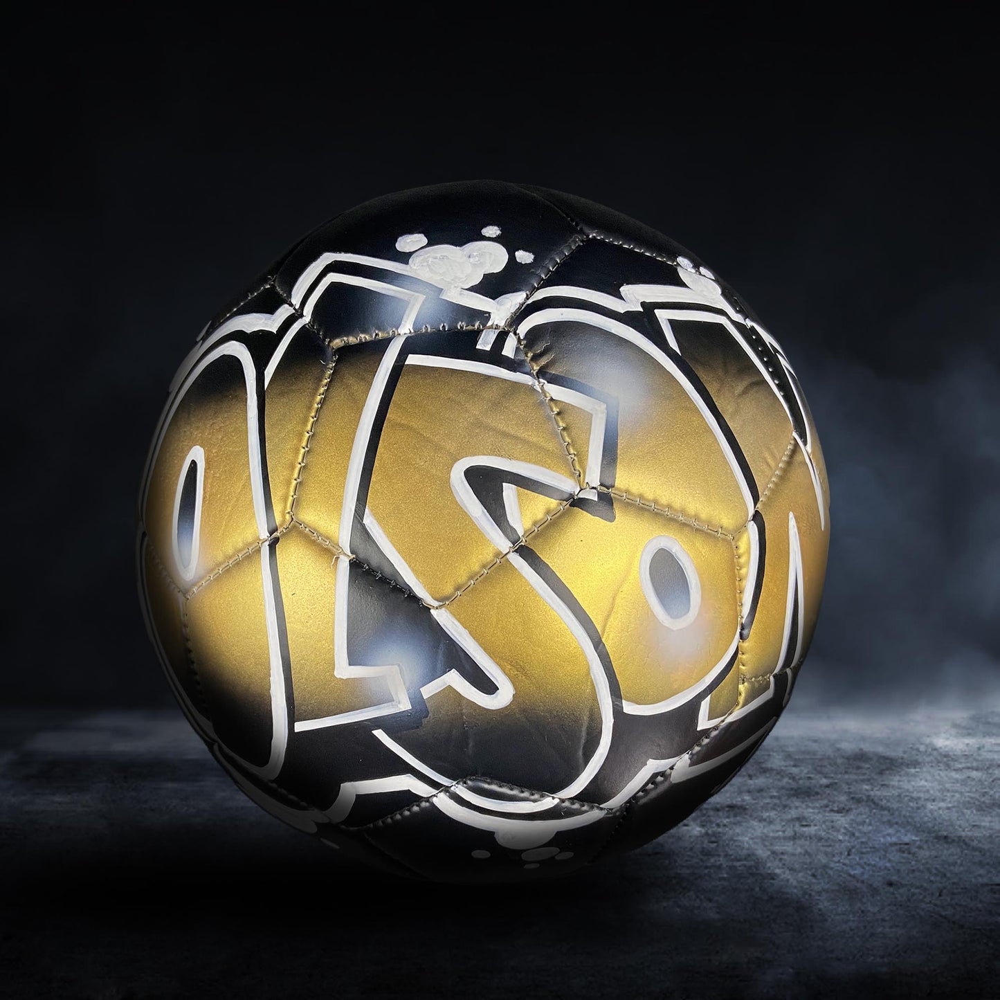 A soccer ball with the word "SON" written on it in a stylized, graffiti-like font.