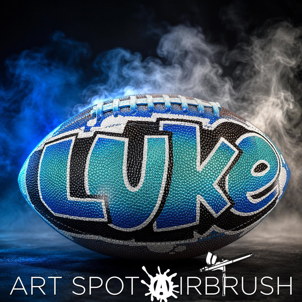A personalized custom football with the name "LUE" written on it, surrounded by smoke and a dark background.
