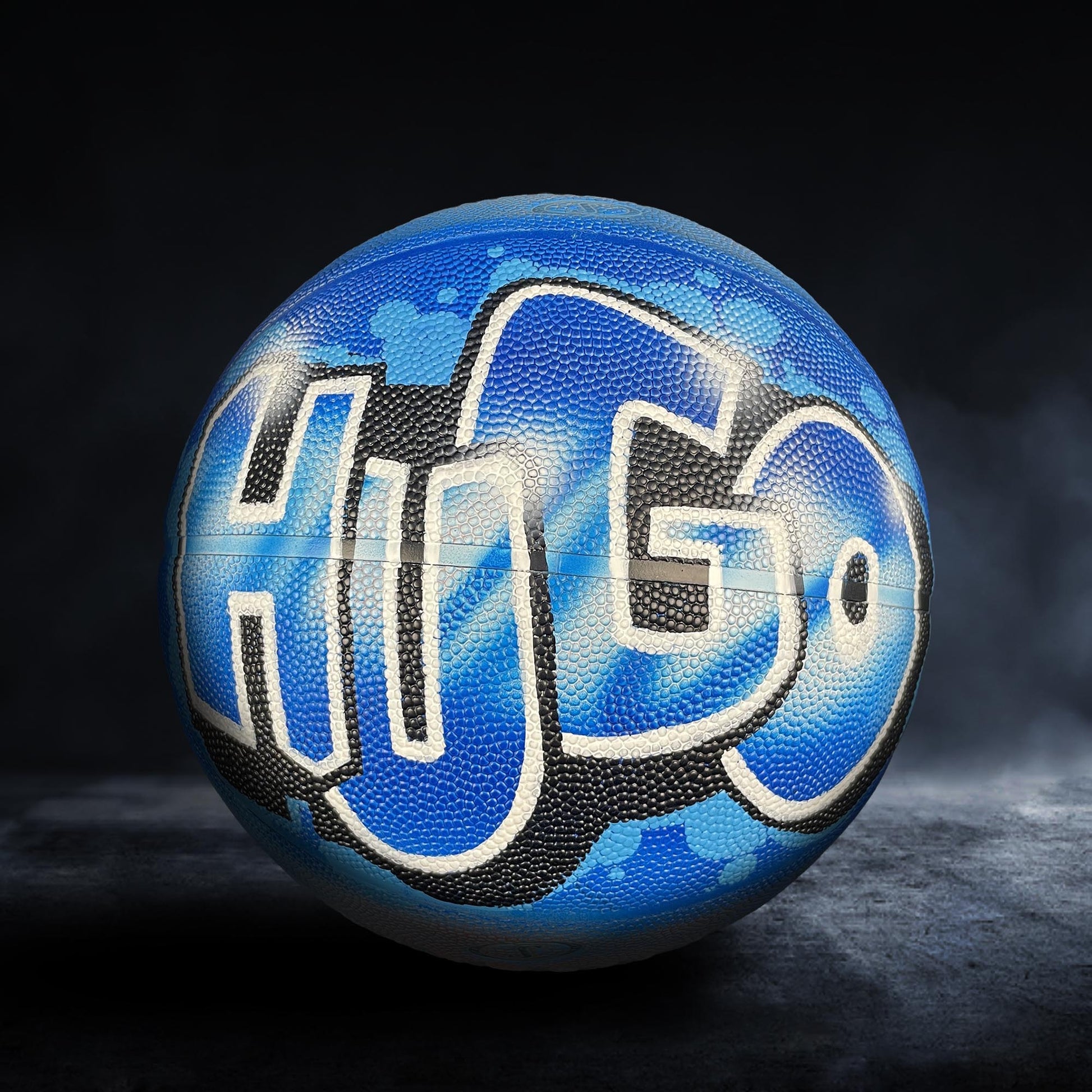 A blue basketball with the word "HOGO" painted on it.
