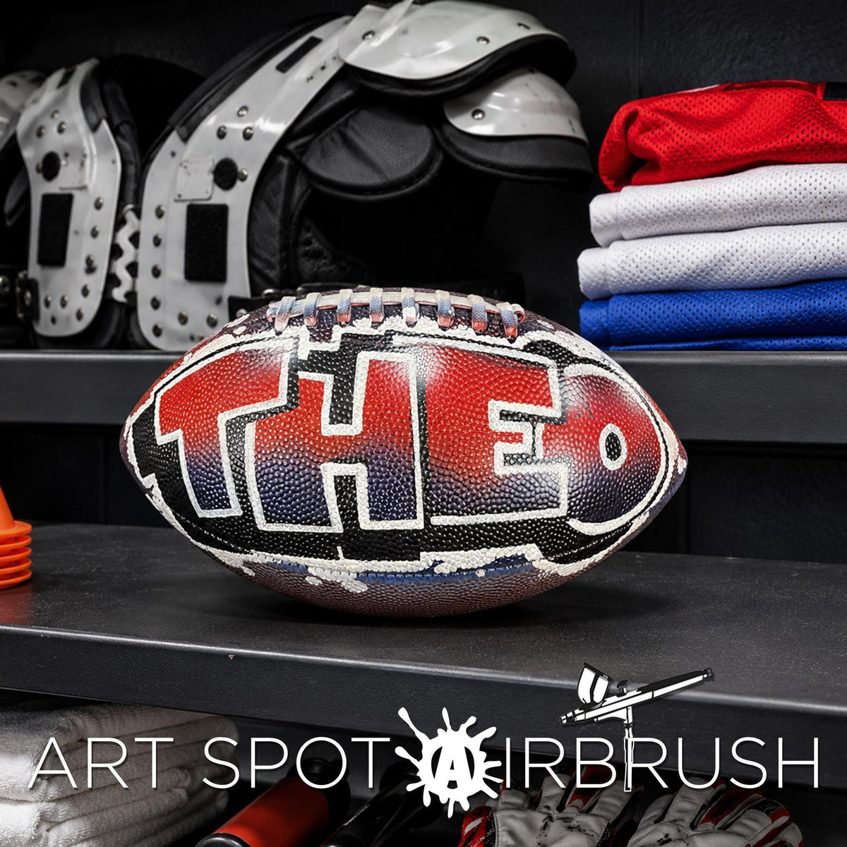 A personalized custom football with the word "THEO" on it, along with a football helmet and other sports gear, displayed on a shelf.