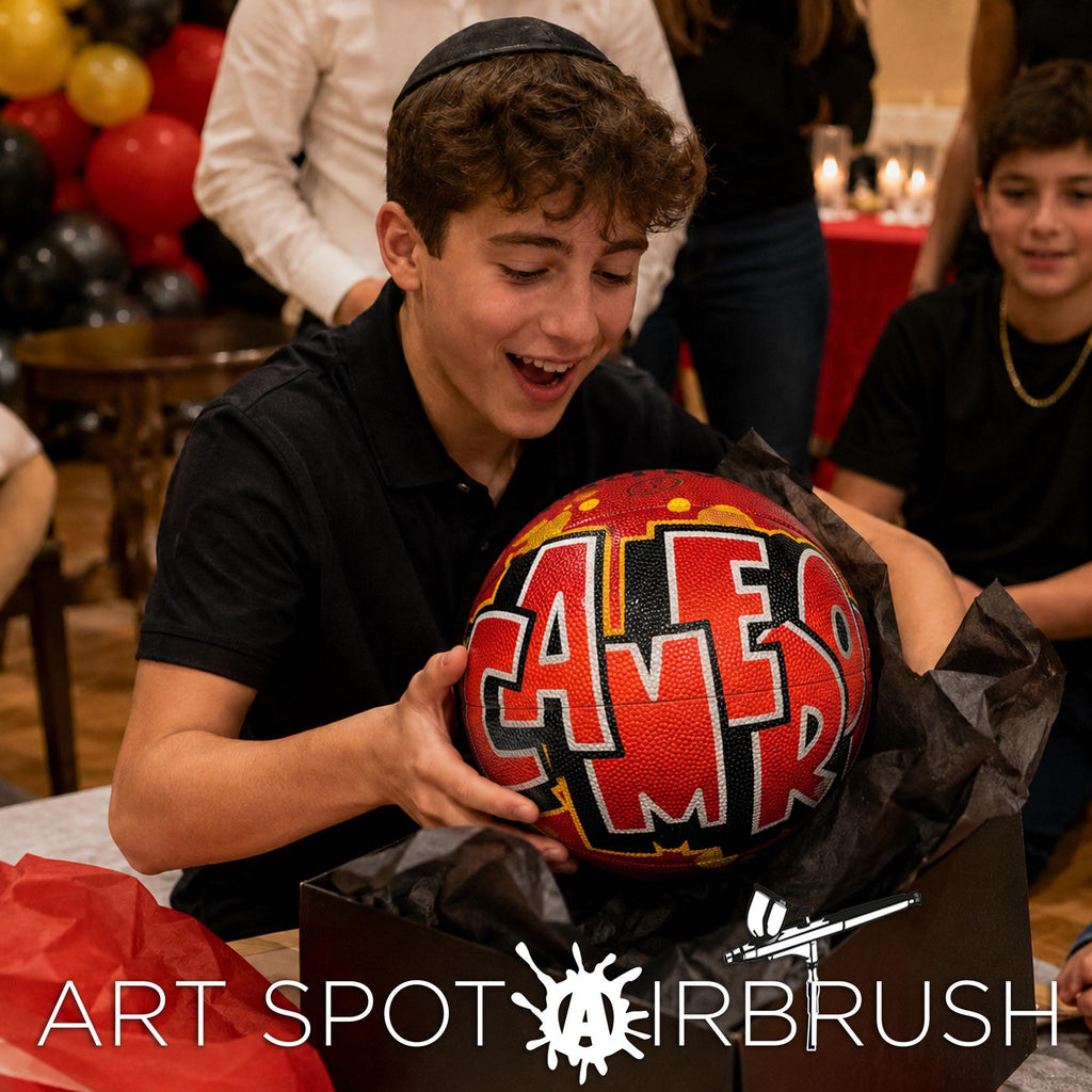 A young boy is holding a red basketball with the word "CALEMBRE" written on it, and he is smiling.