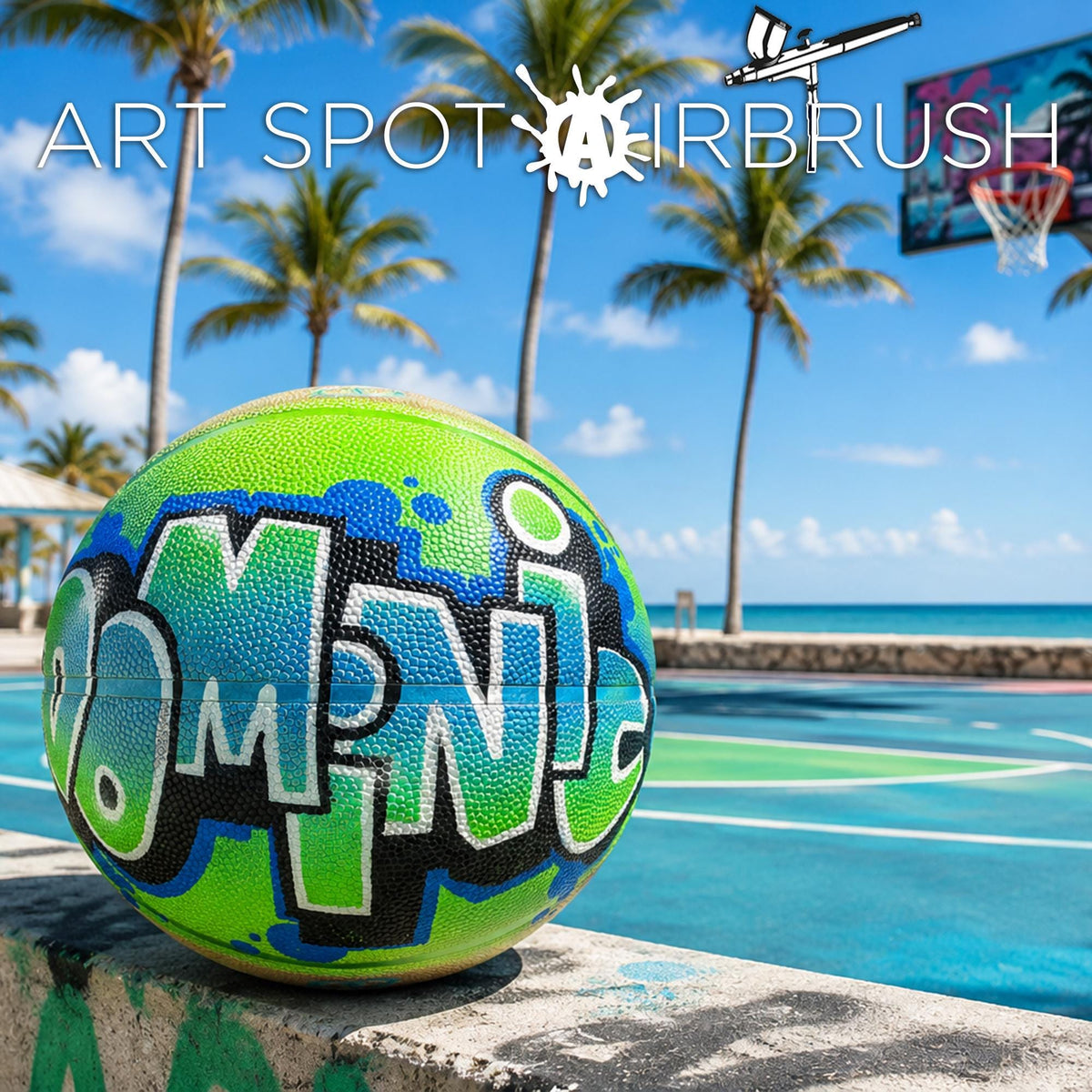 A colorful basketball with the word "MNY" painted on it, sitting on a concrete ledge near a basketball court with palm trees and a clear blue sky in the background.