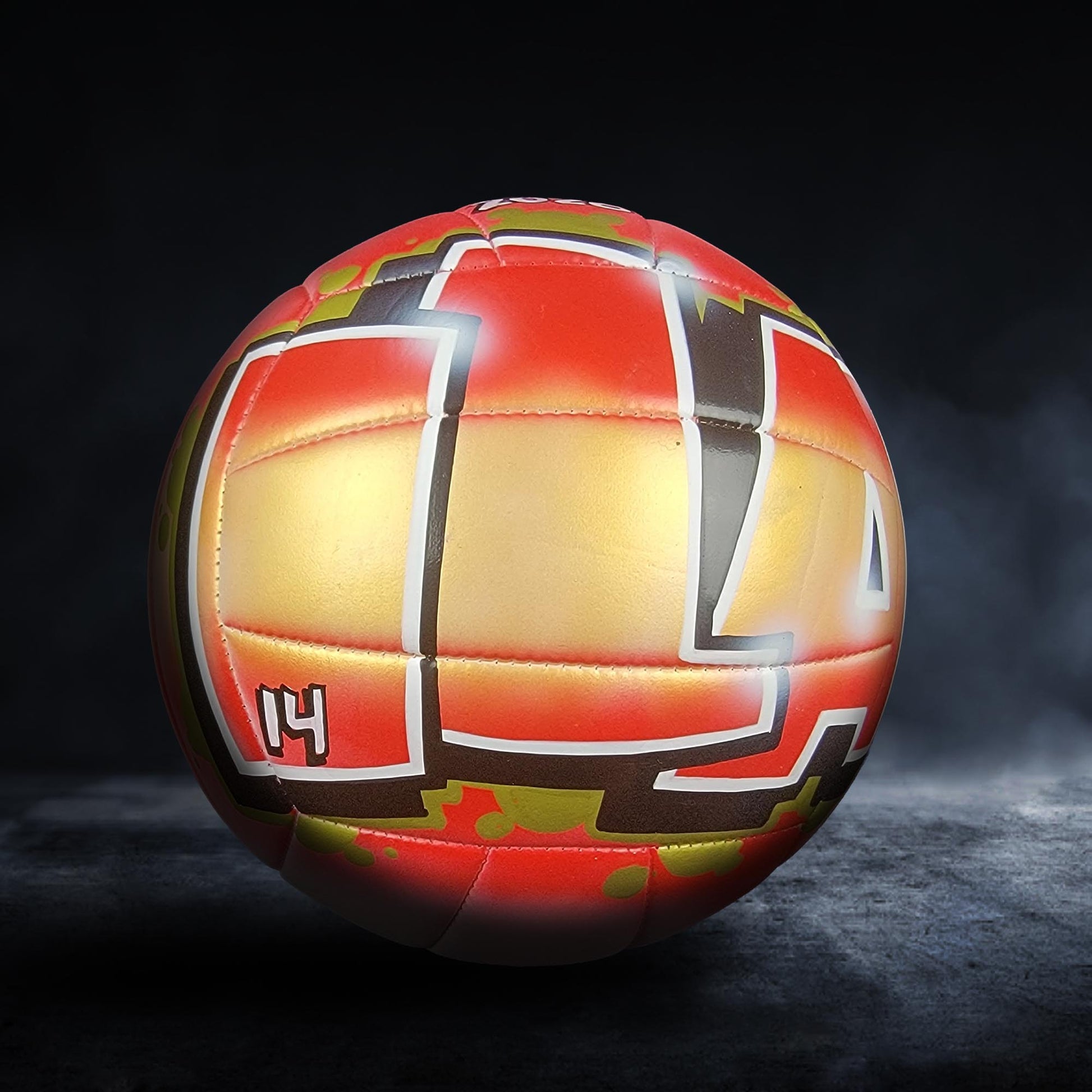 A colorful soccer ball with a bold, geometric design is shown against a dark background.