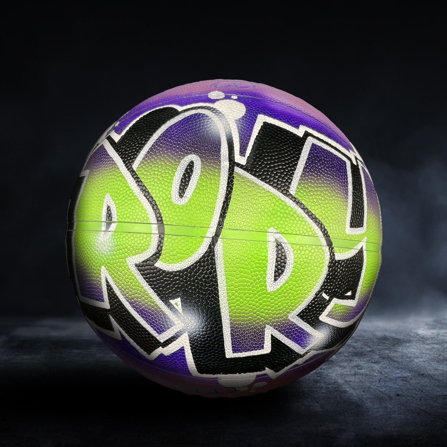 A basketball with the word "POP" painted on it in a colorful, graffiti-style design.
