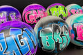 A collection of colorful, graffiti-style sports balls with various names and designs painted on them.