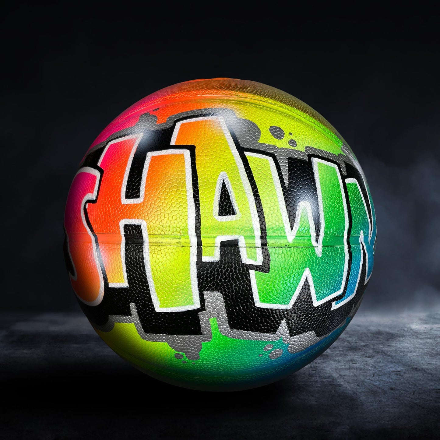 A colorful basketball with the word "SHAW" painted on it.