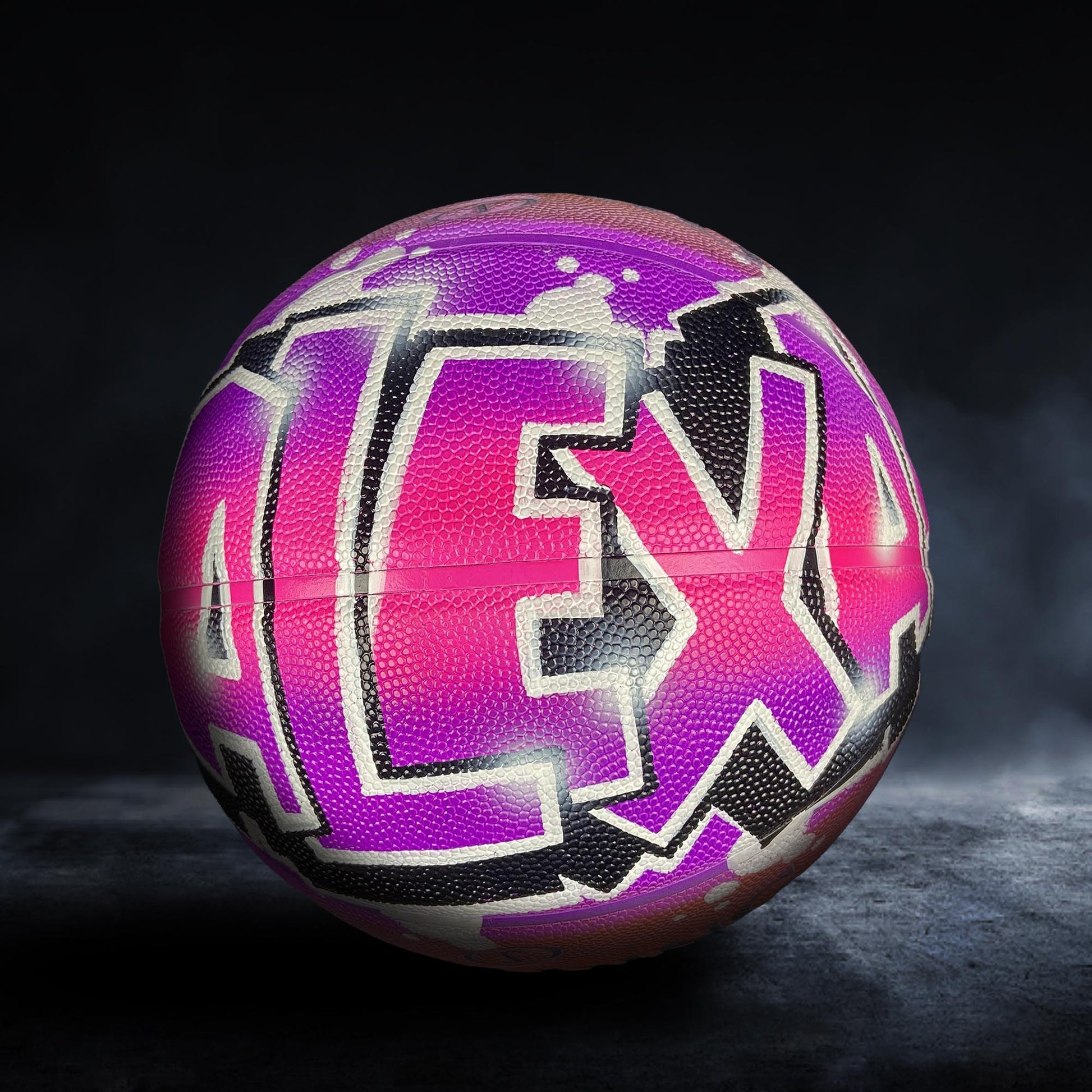 A colorful basketball with the word "ALEX" painted on it in a stylized, graffiti-like design.