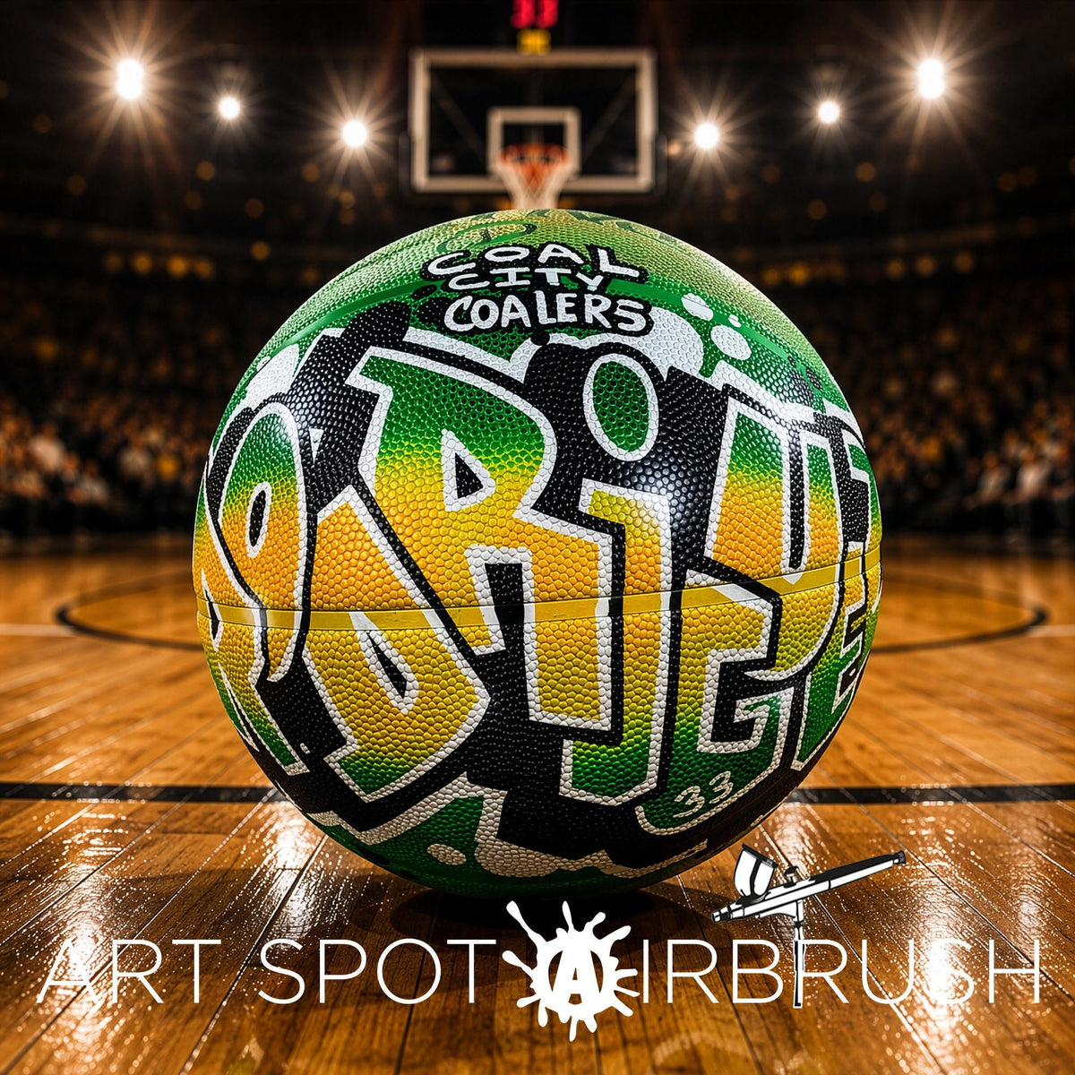 A basketball with graffiti on it, placed on a basketball court with a blurred audience in the background.
