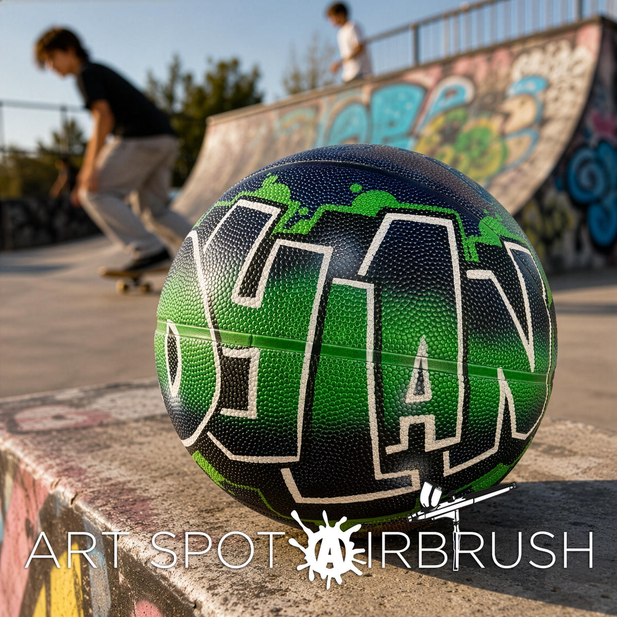 A green and black basketball with the word "GIAN" painted on it, sitting on a ledge at a skate park with graffiti on the wall in the background.