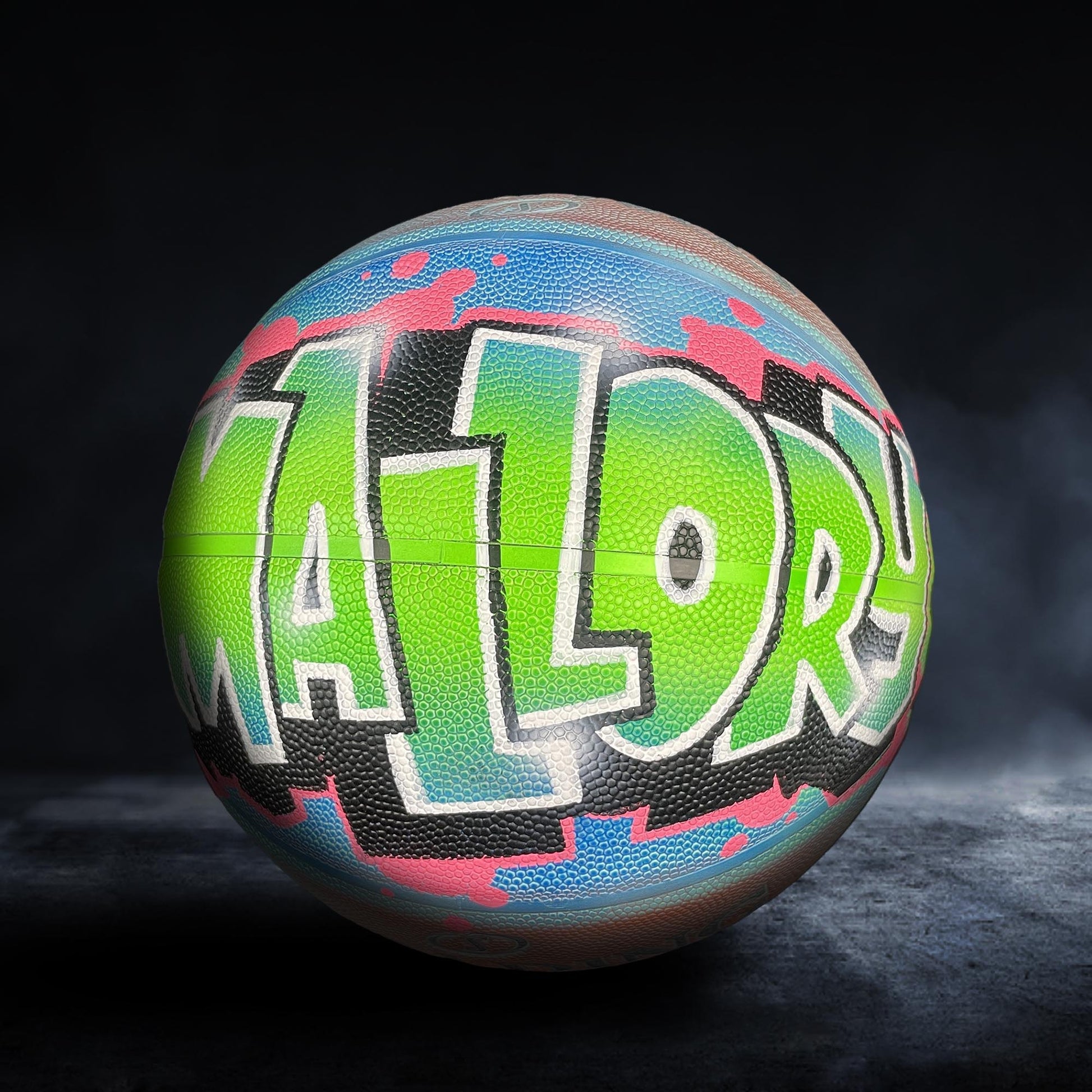 A colorful basketball with the word "MALOR" painted on it.
