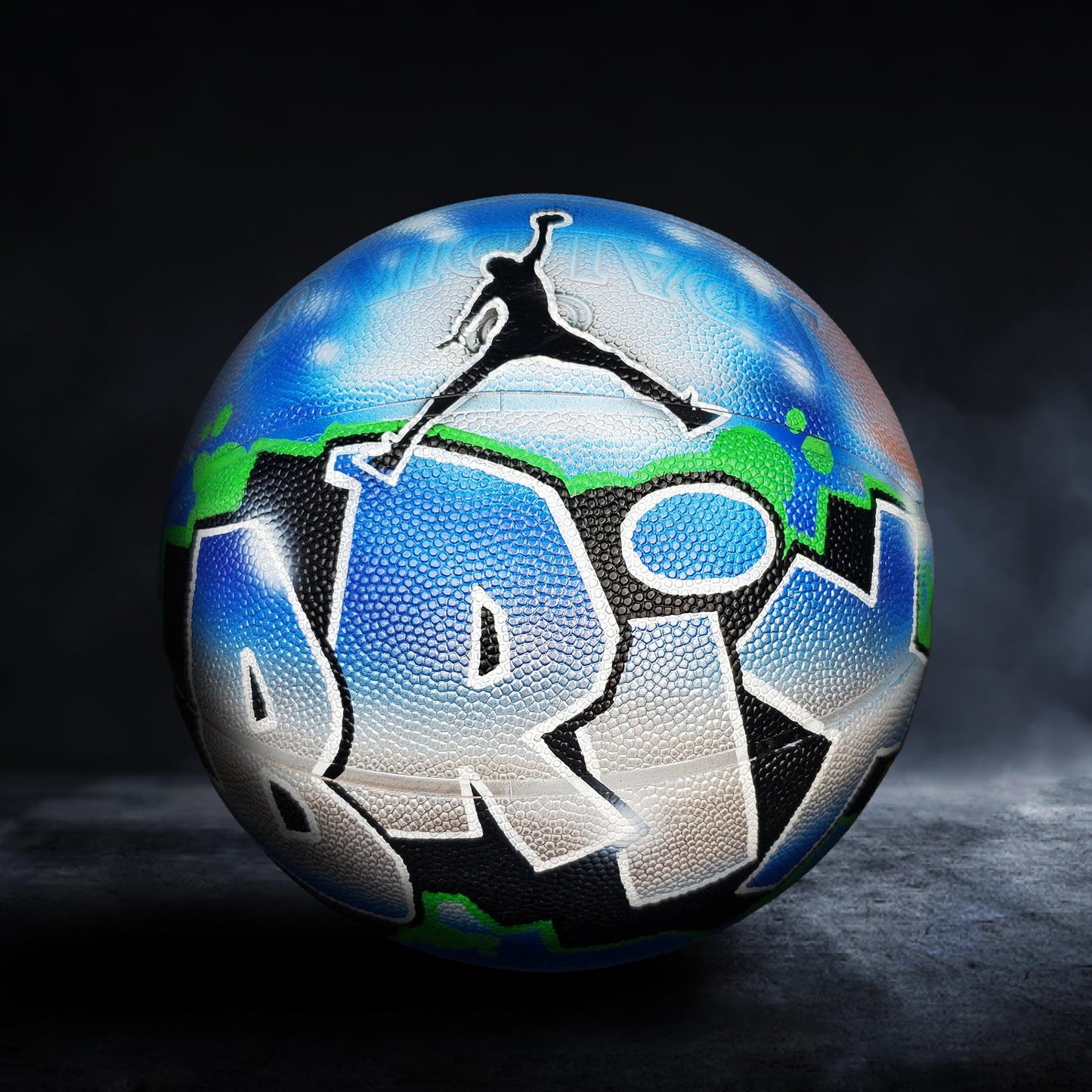 A basketball with a colorful, graffiti-style design on it, featuring the word "BRU" prominently displayed.