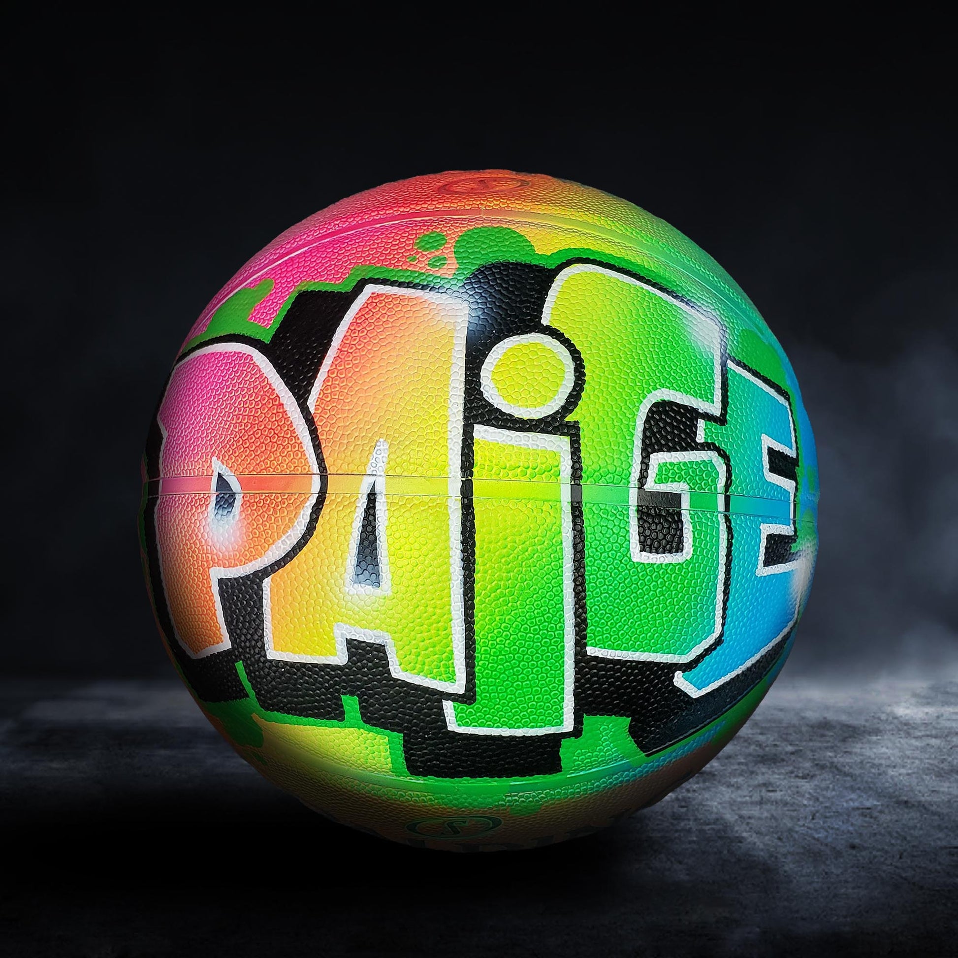 A colorful basketball with the name "PAIGE" painted on it.