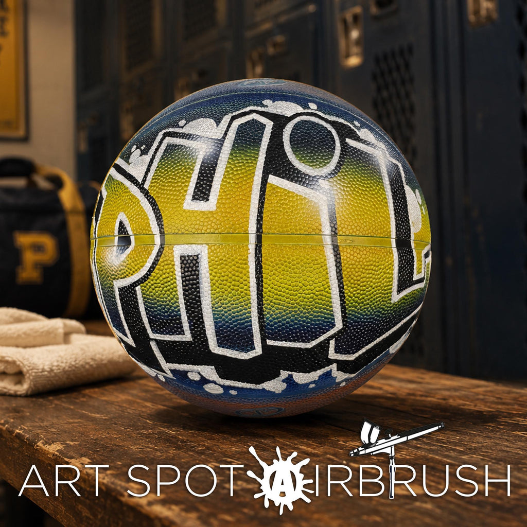 A basketball with the word "PHIL" painted on it, sitting on a wooden surface.