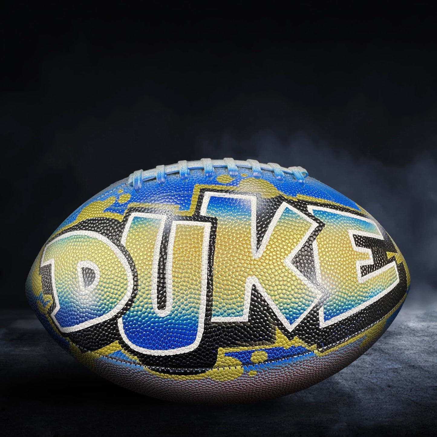 A football with the word "DUKE" painted on it, featuring a colorful and artistic design.