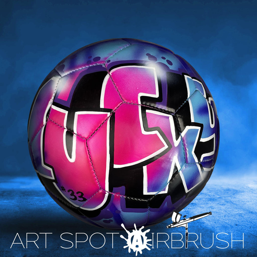 A colorful soccer ball with graffiti-style lettering on it, set against a blue background.