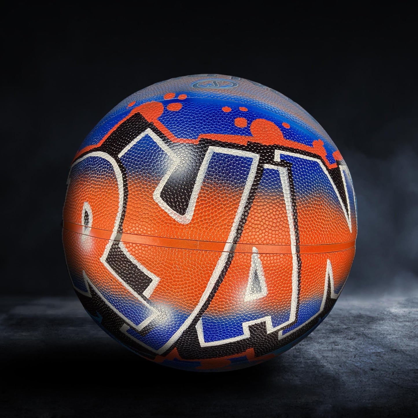 A basketball with the word "DANGER" painted on it in a colorful, graffiti-style design.