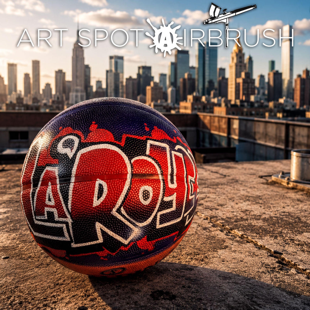 A basketball with the word "AROY" painted on it, sitting on a rooftop with a city skyline in the background.