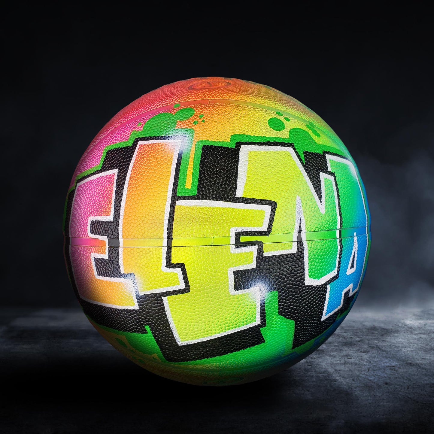 A colorful basketball with the name "ELENA" painted on it.