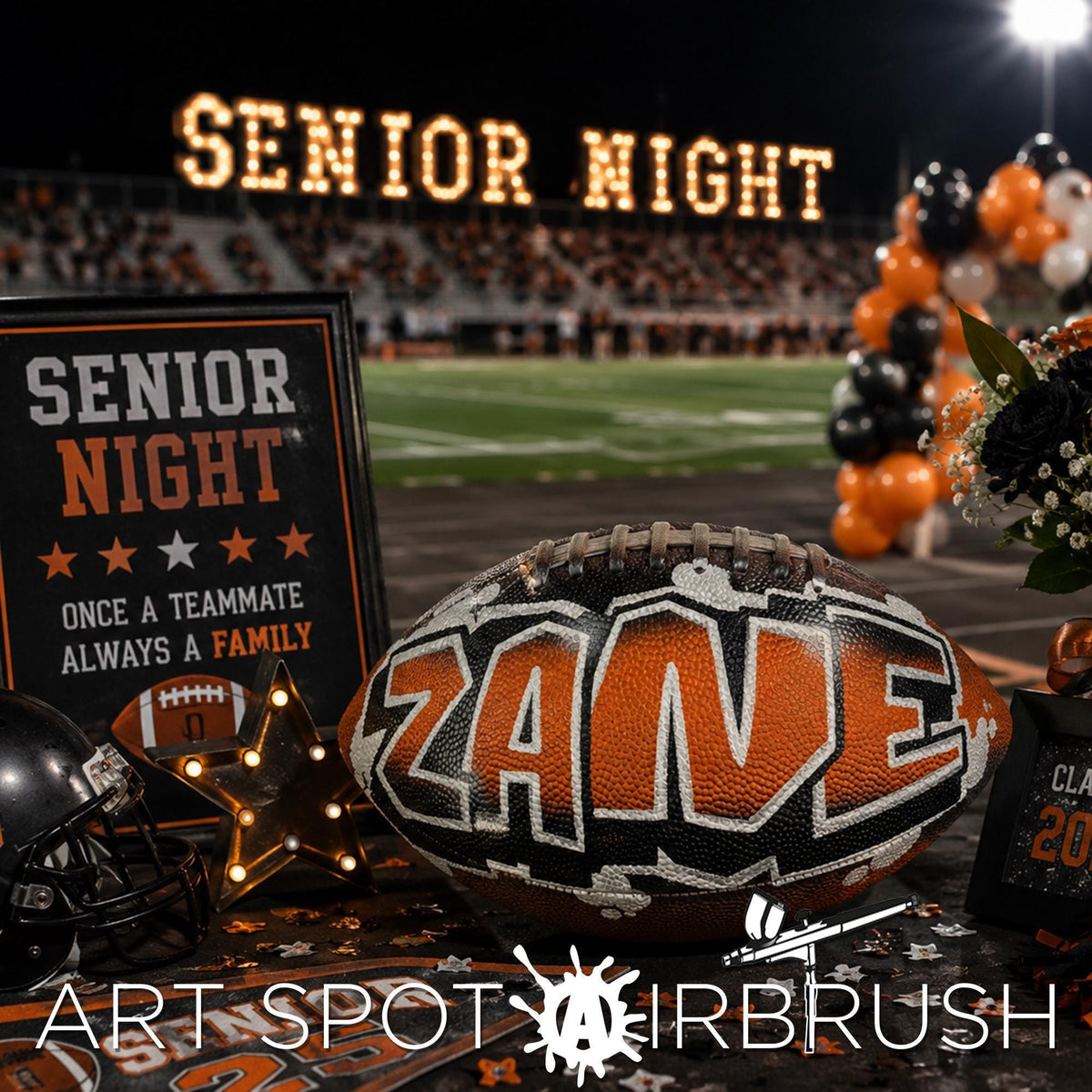 a football with the name "Zane" written on it, surrounded by decorations and a sign that reads "SENIOR NIGHT".