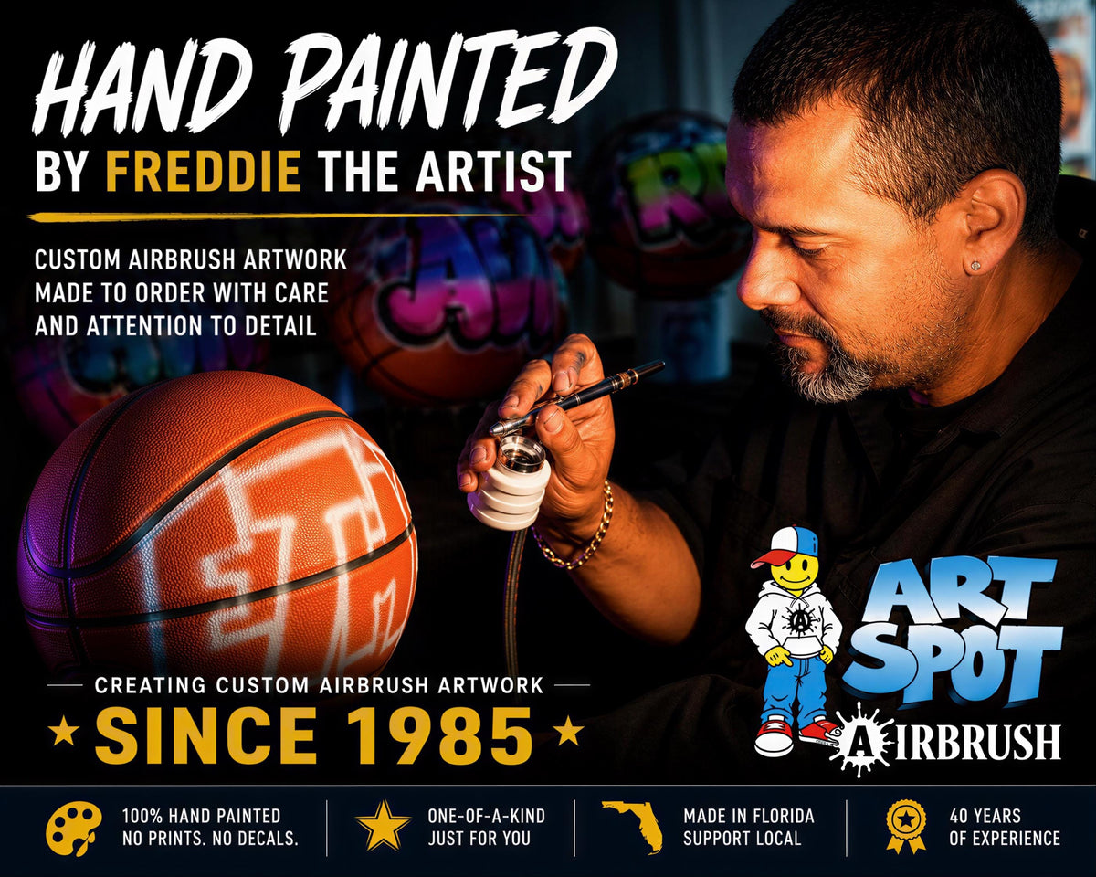 The image is an advertisement for a hand-painted basketball featuring a man painting it. The ad highlights the custom airbrush artwork, the artist's attention to detail, and the quality of the work.
