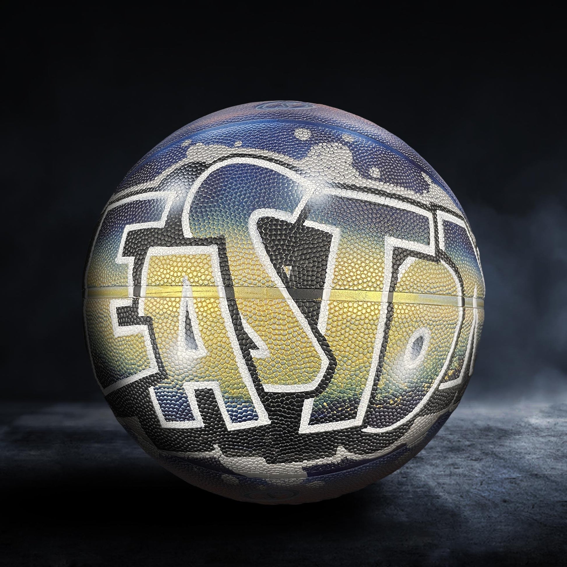 A basketball with the word "EASTON" painted on it, featuring a colorful and artistic design.