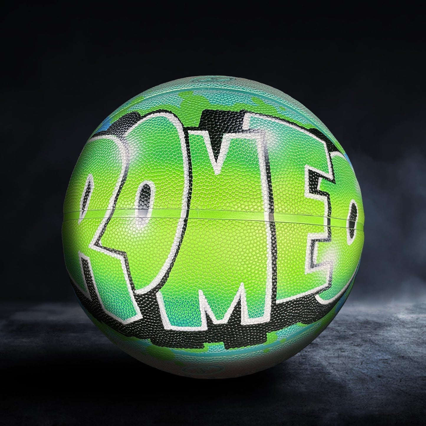 A neon green basketball with the word "ROMEO" painted on it.