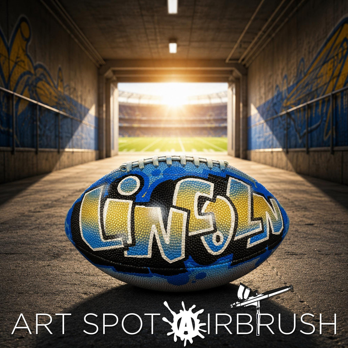 A custom football personalized with the word "LINCOLN" painted on it, sitting in a tunnel with graffiti on the walls.