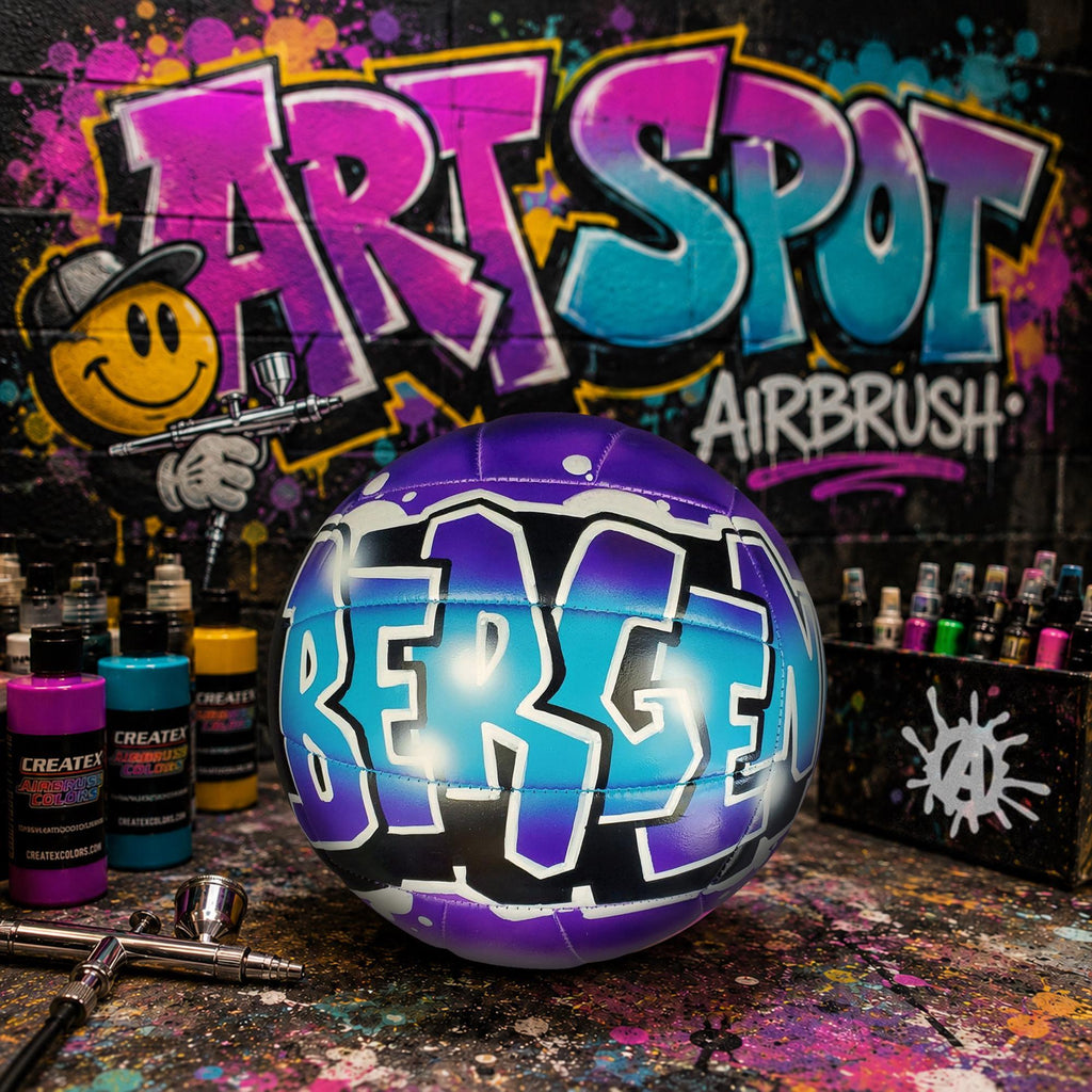 A custom-painted volleyball with the name "BERG" in graffiti-style lettering, surrounded by spray paint cans and a graffiti-style background.