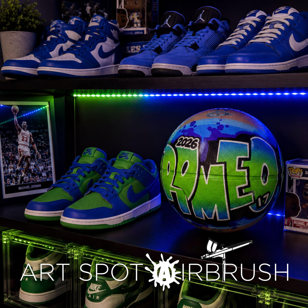 A collection of sports memorabilia, including sneakers, a basketball, and framed photos, displayed on a shelf with a green LED strip lighting the background.