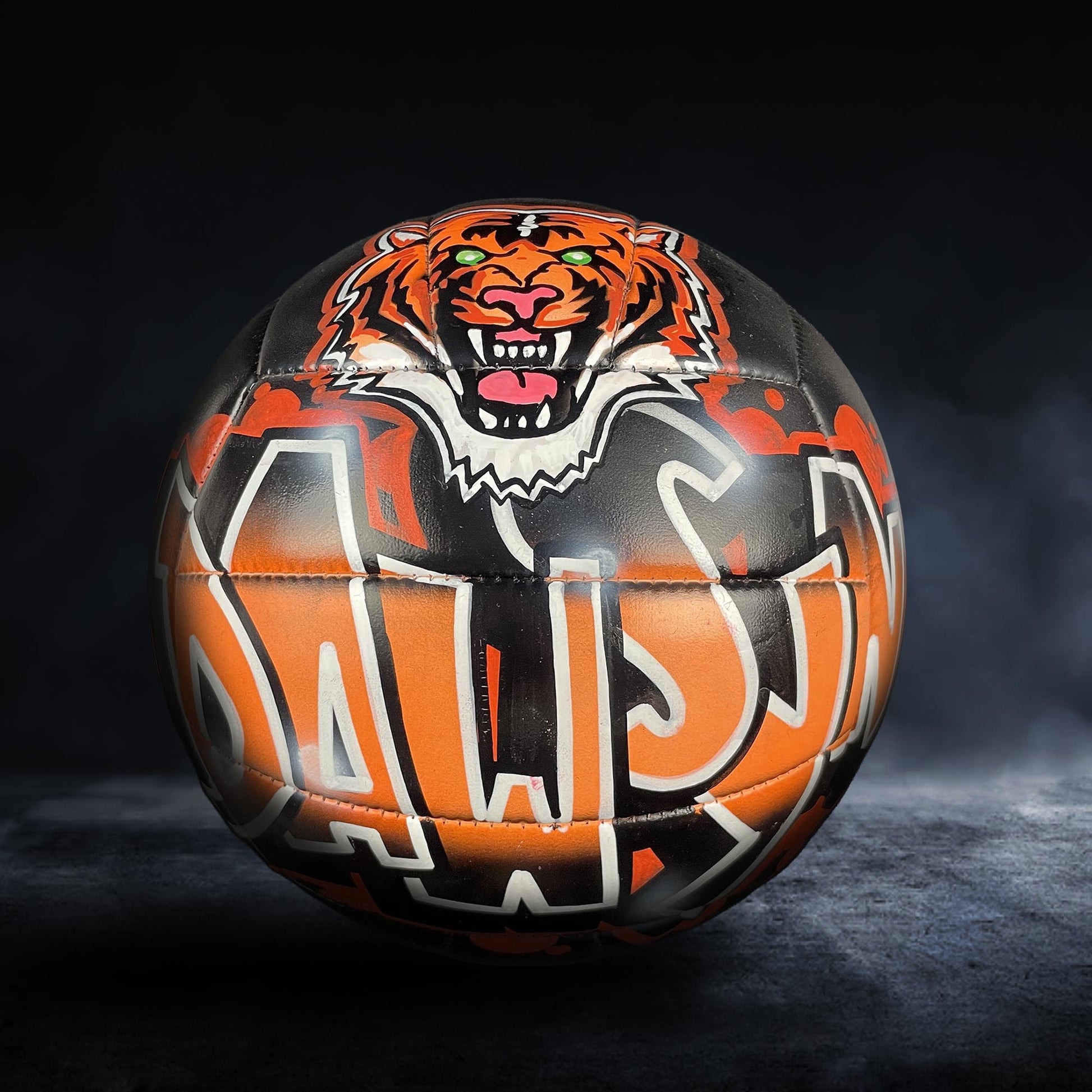 A sports ball with a tiger design on it.