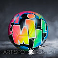 A colorful, graffiti-style soccer ball with the text "ART SPOT AIRBRUSH" displayed on it.
