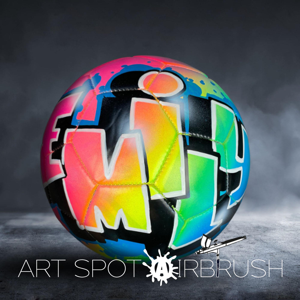 A colorful, graffiti-style soccer ball with the text "ART SPOT AIRBRUSH" displayed on it.
