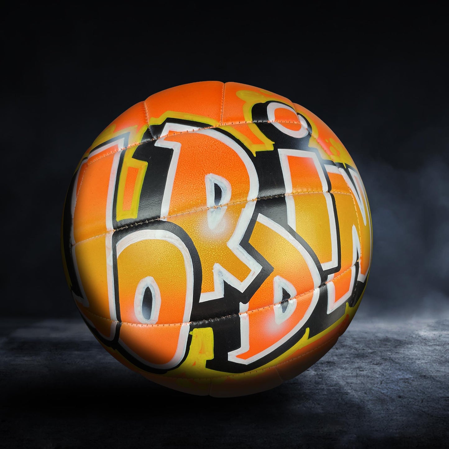 a colorful, graffiti-style soccer ball with the word "LOT" prominently displayed on it.