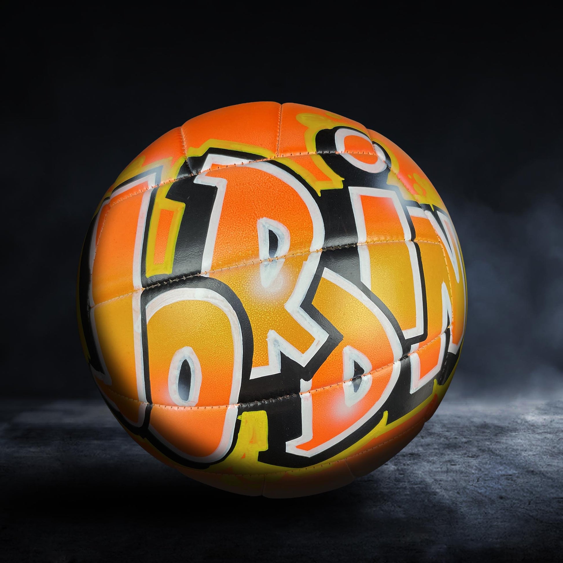a colorful, graffiti-style soccer ball with the word "LOT" prominently displayed on it.