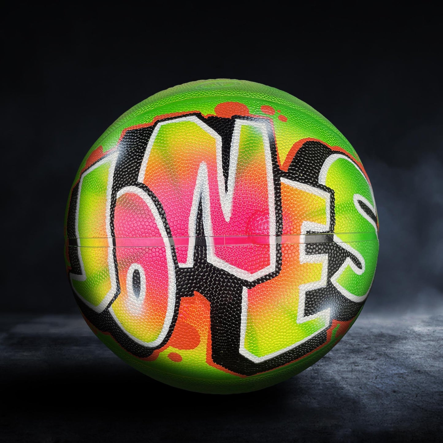 A colorful basketball with the name "Jones" painted on it.