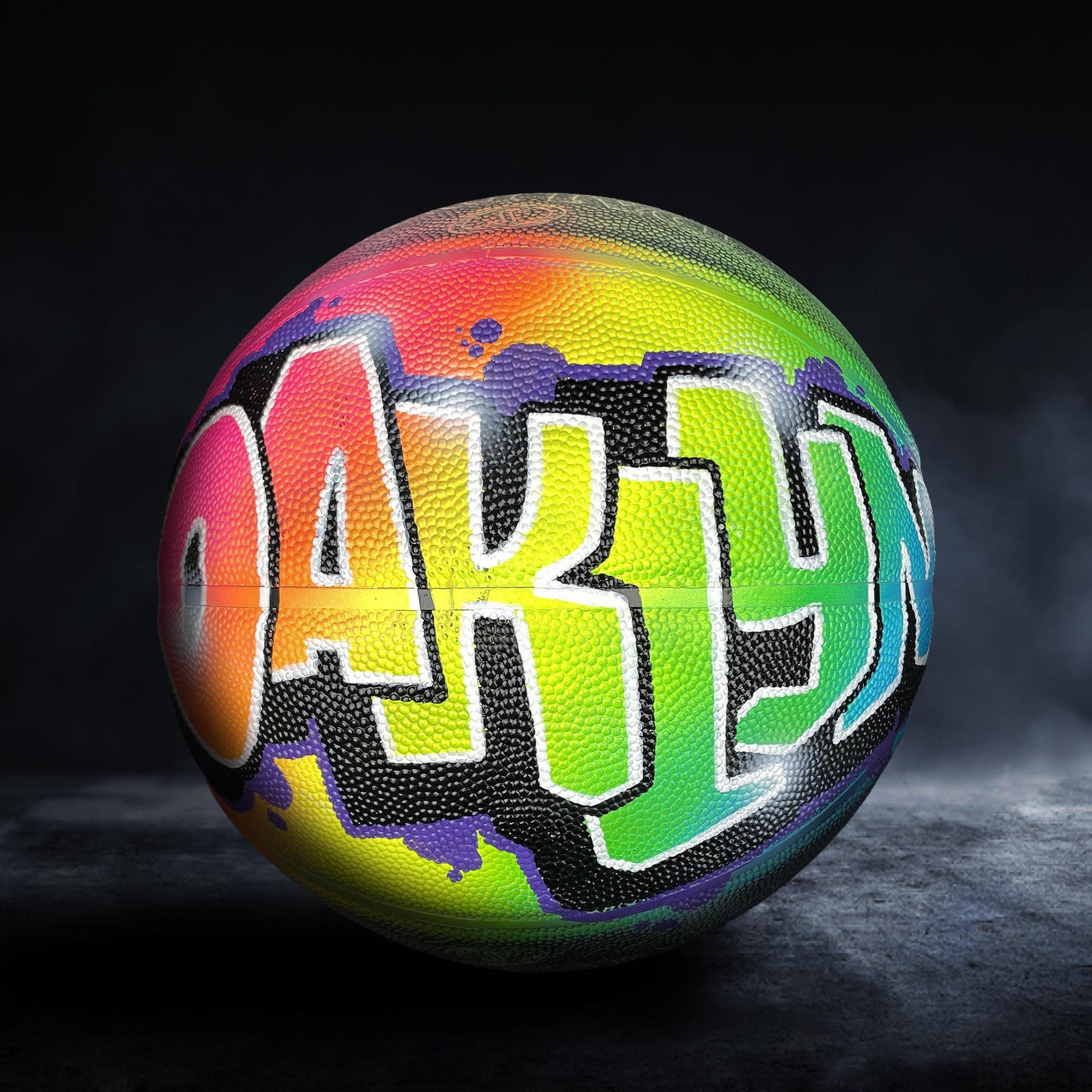 A colorful basketball with the word "OAK" painted on it.