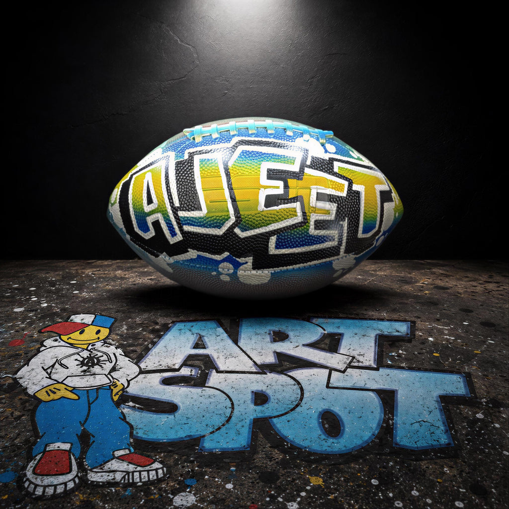 a football with the word "AJET" painted on it, along with a cartoon character standing next to it. The background is dark, and there is graffiti-style text on the ground that reads "ART SPOT".