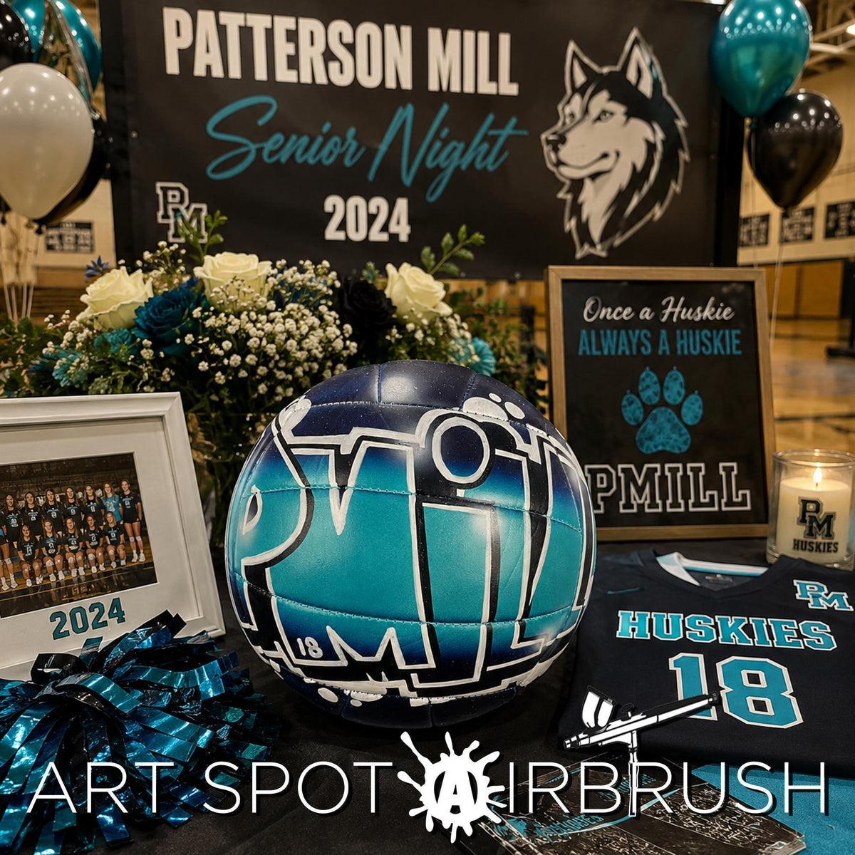 A custom volleyball and A bulletin board displaying a banner for Patterson Mill's Senior Night, surrounded by balloons, a framed photo, a sports ball, and a framed jersey.