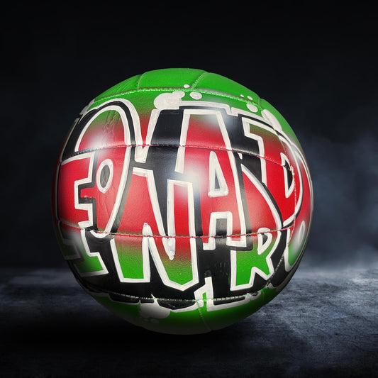 A colorful soccer ball with the word "FOOTBALL" painted on it, set against a dark background.