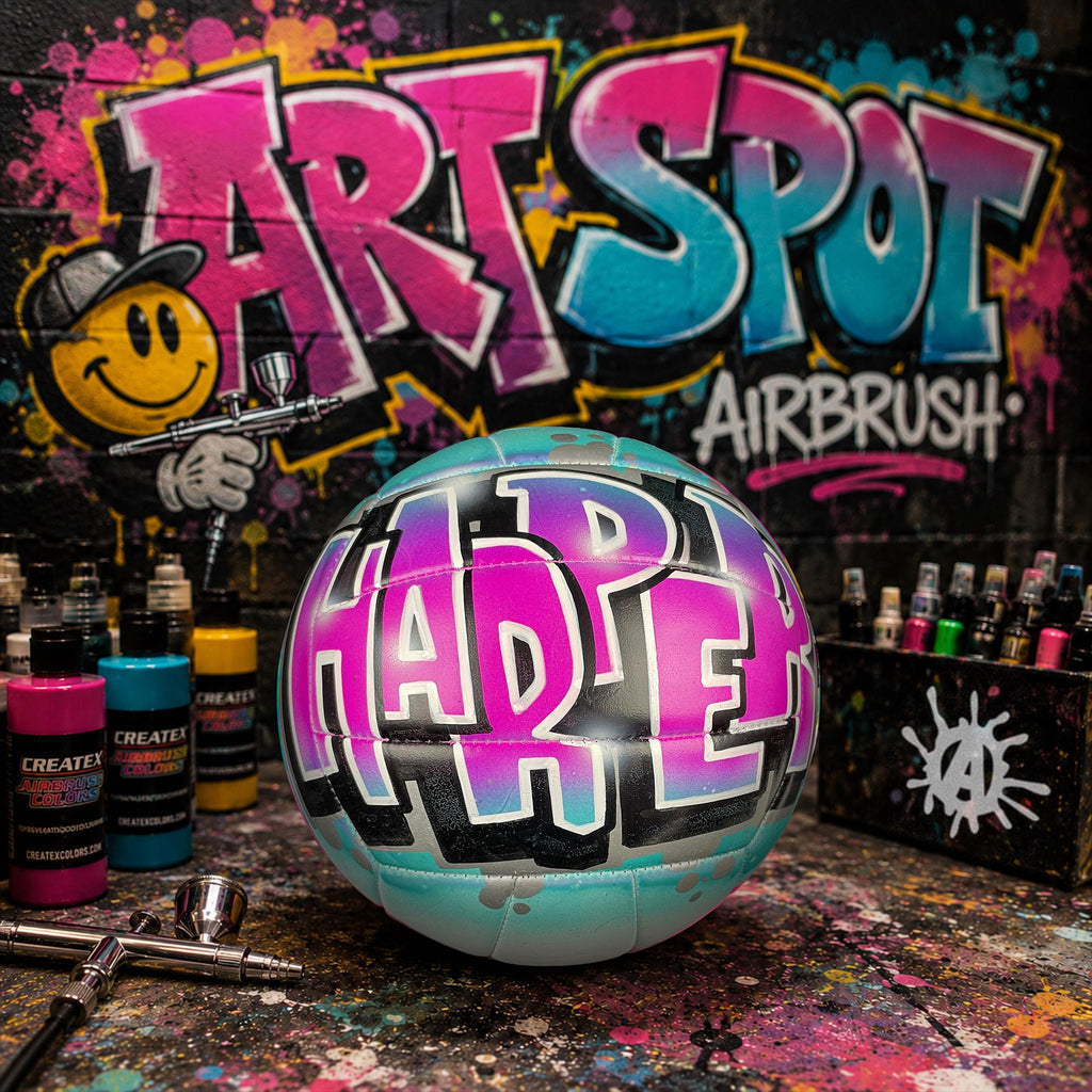 A custom volleyball personalized with the word "HARPER" written on it, surrounded by graffiti art and various art supplies.