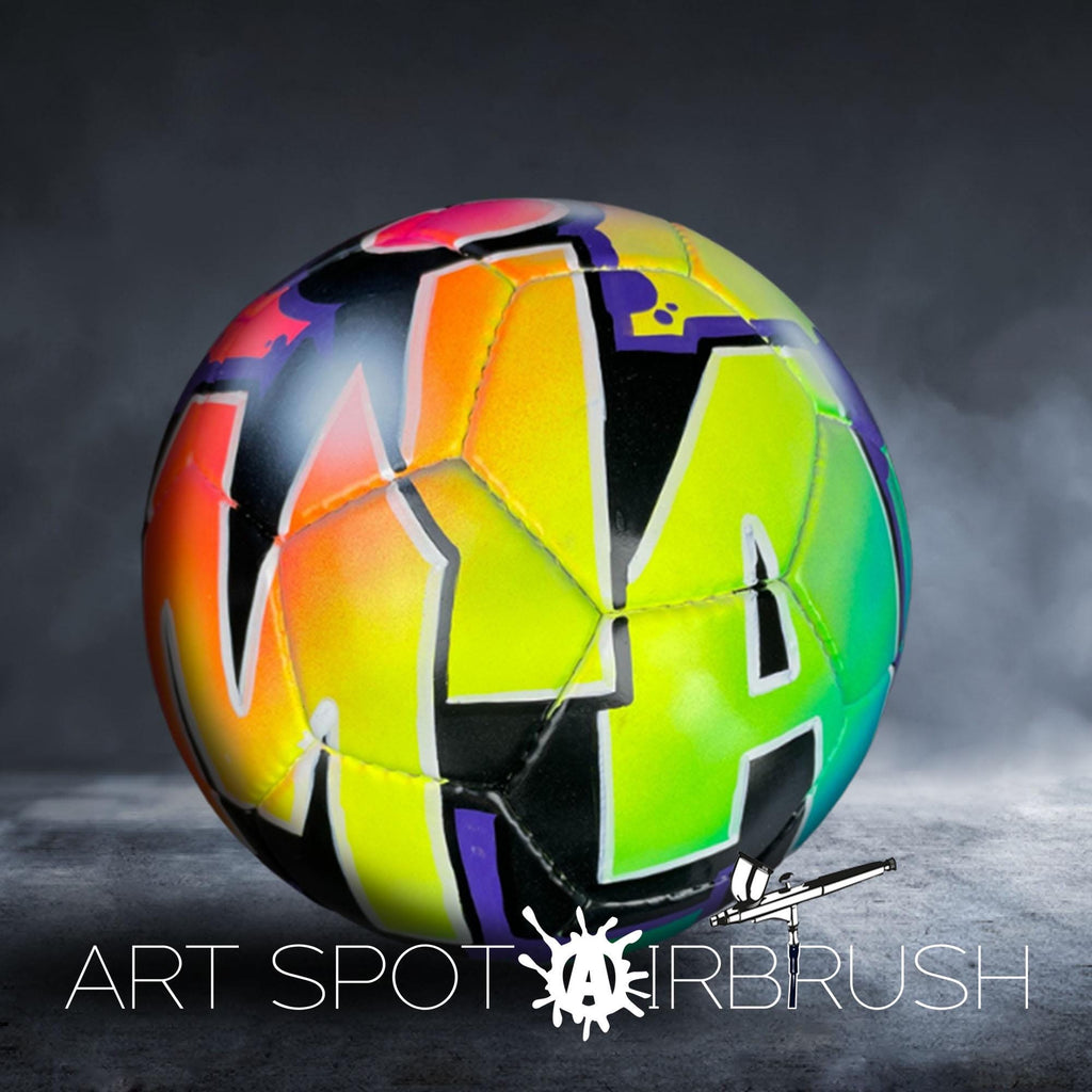 A colorful, graffiti-style soccer ball with the text "ART SPOT AIRBRUSH" displayed on it.